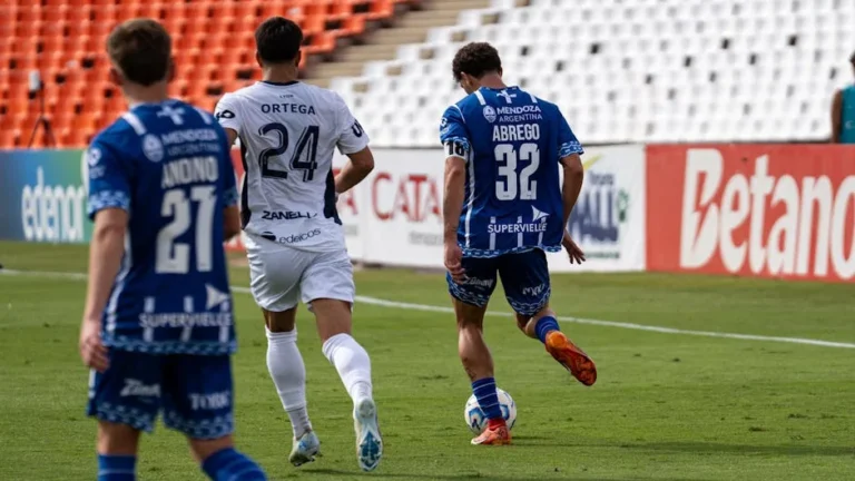 Dynamic soccer match with players competing in a stadium setting.