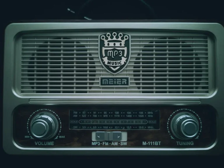 Close-up of a retro MP3 radio with tuning dials and vintage logo.