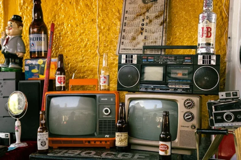 A nostalgic arrangement of vintage electronics and bottles in a retro setting.