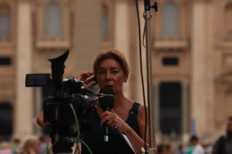 Journalist reporting live from Vatican City, capturing the essence of urban broadcast journalism.